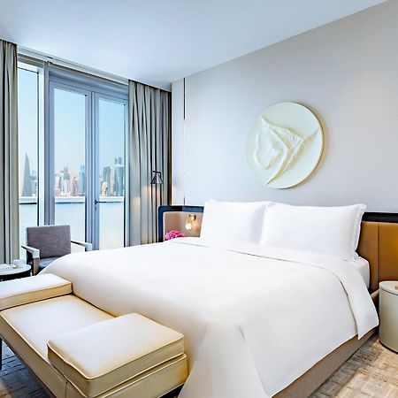 แมนดาริน โอเรียนเต็ล โดฮา Hotel ภายนอก รูปภาพ A bedroom at the hotel